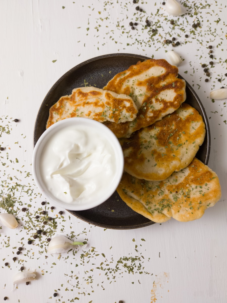 a plate of food with a bowl of sour cream